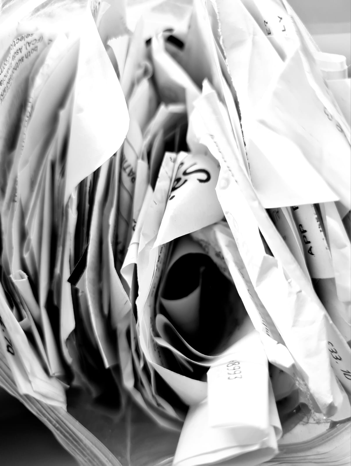 Stacked filing boxes and folders — a lifetime of paperwork waiting to be sorted